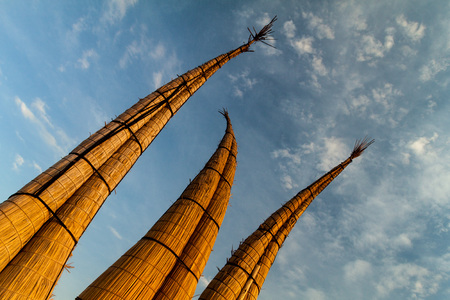 Traditional reed boats on a beach in Huanchaco, Peru.の写真素材