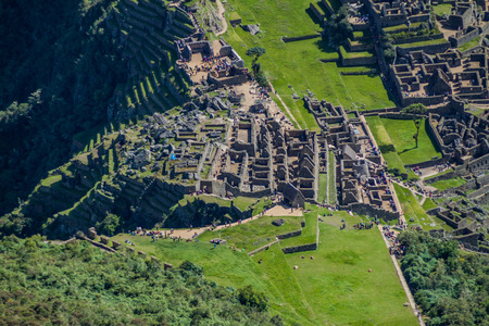 MACHU PICCHU, PERU - MAY 18, 2015: Aerial view of crowds of tourists on Machu Picchu ruins, Peruの写真素材