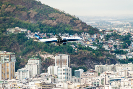 RIO DE JANEIRO, BRAZIL - JANUARY 28, 2015: Airplane of Azul airlines flights over Rio de Janeiro, Brazilのeditorial素材