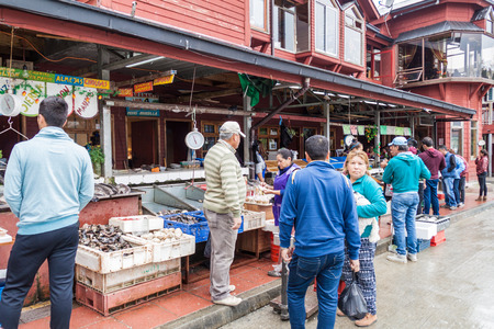 PUERTO MONTT, CHILE - MARCH 1, 2015: People at the fish market in Puerto Montt, Chileのeditorial素材
