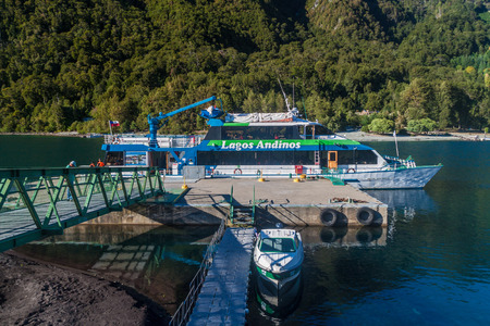 PETROHUE, CHILE - MARCH 25, 2015: Boat Lagos Andinos anchored at Petrohue river in Petrohue village, Chileのeditorial素材