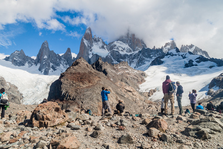 EL CHALTEN, ARGENTINA - MARCH 11, 2015: Tourists near Laguna de los Tres lake observe Fitz Roy mountain in National Park Los Glaciares, Patagonia, Argentinaのeditorial素材
