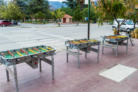 CAFAYATE, ARGENTINA - APRIL 5, 2015: Foosball tables on Plaza 20 de Febrero square in Cafayate,...