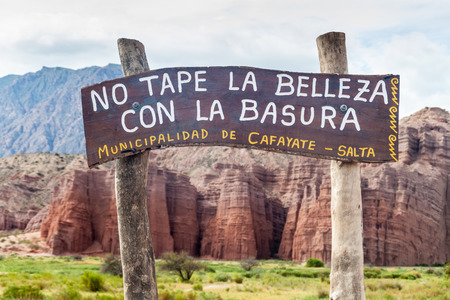 Wooden sign in Quebrada de Cafayate valley, Argentina. It says: Do not cover the beauty with a garbage.のeditorial素材