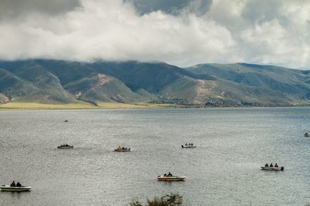 TAFI DEL VALLE, ARGENTINA - APRIL 4, 2015: People at boats at Dique la Angostura reservoir near Tafi...