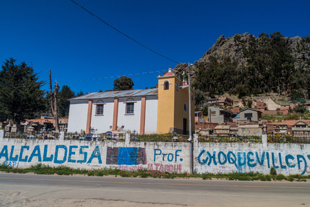 COPACABANA, BOLIVIA - MAY 13, 2015: Wall painted by election campaign in front of a cemetery in Copacabana, Bolivia.のeditorial素材