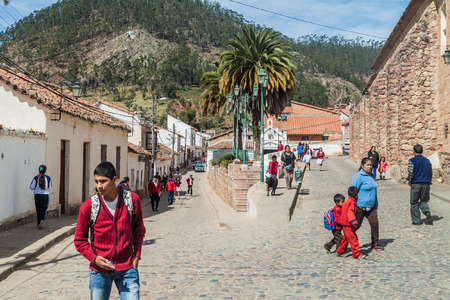 SUCRE, BOLIVIA - APRIL 21, 2015: Local people walk on cobbled streets in Sucre, Boliviaのeditorial素材