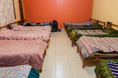 TUPIZA, BOLIVIA - APRIL 13, 2015: Beds in a dorm room of a hostel in Tupiza.のeditorial素材