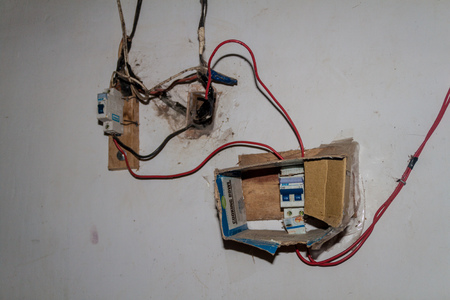 COROICO, BOLIVIA - APRIL 30, 2015:  Dangerous electrical installation in a bolivian house