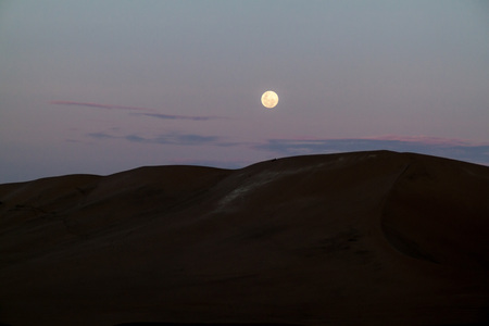 Sand dunes in the desert near Huacachina, Peru. Moon is rising.の写真素材