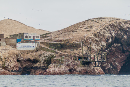 PARACAS, PERU - JUNE 3, 2015: Guano loading post on the rocks of the Ballestas Islands in the Paracas National park, Peru.のeditorial素材