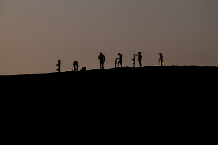 Silhouettes of sand boarders during the sunset near desert oasis Huacachina near Ica, Peruの写真素材