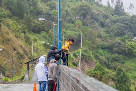 BANOS, ECUADOR - JUNE 20, 2015: People performing bridge jumping (puenting) on San Francisco Bridge in Banos.のeditorial素材