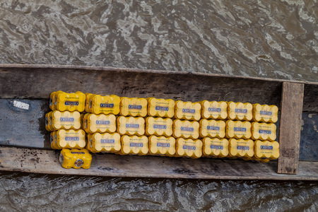 NAPO, PERU - JULY 15, 2015: beer cans in a canoe on a river Napo, Peru