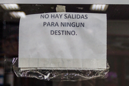 MERIDA, VENEZUELA - AUGUST 20, 2015: Sign on a bus office in Merida says: There are no departures, to no destination. This is causes by severe lack of buses in the country.のeditorial素材