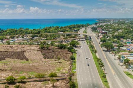 BOCA CHICA, DOMINICAN REPUBLIC - SEP 25, 2015: Aerial view of Boca Chica town in Dominican Republic. Highway 3 and crossing to Las Americas International Airport of Santo Domingo.のeditorial素材