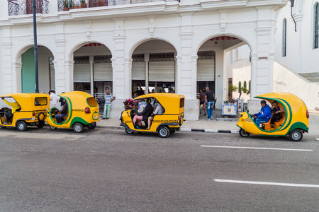HAVANA, CUBA - FEB 20, 2016: Row of coco taxis in the center of Havana.の写真素材