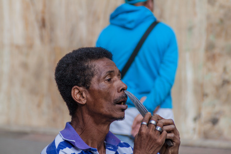 BOGOTA, COLOMBIA - SEPTEMBER 24, 2015: Street performer with knives in downtown of Bogota.のeditorial素材