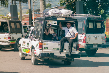 PITALITO, COLOMBIA - SEPTEMBER 15, 2015: Passengers of a public transport vehicle in Colombia.のeditorial素材