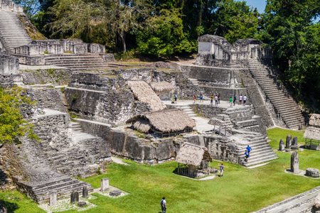 TIKAL, GUATEMALA - MARCH 14, 2016: Tourists at the Gran Plaza at the archaeological site Tikal, Guatemalaのeditorial素材