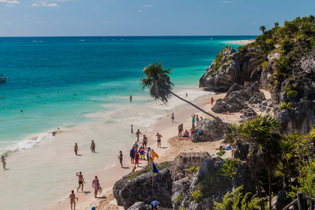 TULUM, MEXIO - FEB 29, 2016: Tourists at the beach under the ruins of the ancient Maya city Tulum, Mexicoのeditorial素材