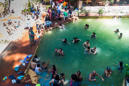 FUENTES GEORGINAS, GUATEMALA - MARCH 22, 2016: People bathing in a thermal pool Funtes Georginas.のeditorial素材