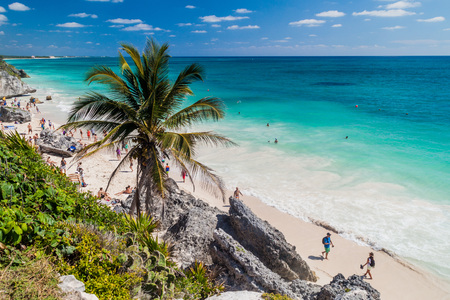 TULUM, MEXIO - FEB 29, 2016: Tourists at the beach under the ruins of the ancient Maya city Tulum, Mexicoのeditorial素材