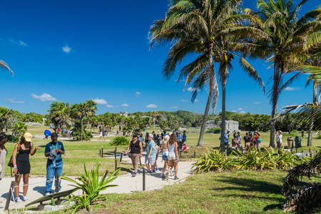 TULUM, MEXIO - FEB 29, 2016: Tourists visit the ruins of the ancient Maya city Tulum, Mexicoのeditorial素材