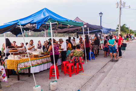 FLORES, GUATEMALA - MARCH 11, 2016: Food stalls at a lakeside promenade in Flores, Guatemalaのeditorial素材