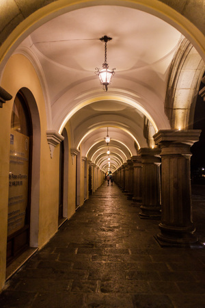 ANTIGUA, GUATEMALA - MARCH 27, 2016: Night view of the archway of Palacio de los Capitanes Generales  (Palace of the Captains General) in Antigua, Guatemala.のeditorial素材