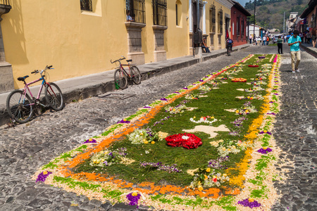 ANTIGUA, GUATEMALA - MARCH 27, 2016: Decorated carpet on the street before the procession on Easter Sunday in Antigua Guatemala city.のeditorial素材