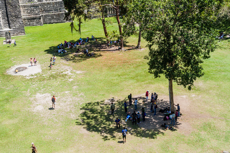 TIKAL, GUATEMALA - MARCH 14, 2016: Tourists at the Gran Plaza at the archaeological site Tikal, Guatemalaのeditorial素材