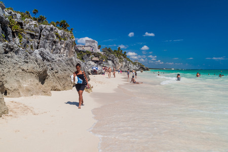TULUM, MEXIO - FEB 29, 2016: Tourists at the beach under the ruins of the ancient Maya city Tulum, Mexicoのeditorial素材