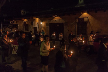 ANTIGUA, GUATEMALA - MARCH 27, 2016: Participants of the nighttime procession on Easter Sunday in...