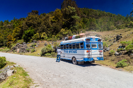 SAN MATEO IXTATAN, GUATEMALA - MARCH 19, 2016: Local bus on a road San Mateo Ixtatan - Yalambojoch.のeditorial素材