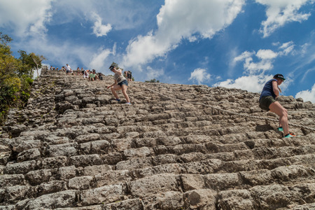 COBA, MEXICO - MARCH 1, 2016: Tourist climb the Pyramid Nohoch Mul at the ruins of the Mayan city Coba, Mexicoのeditorial素材