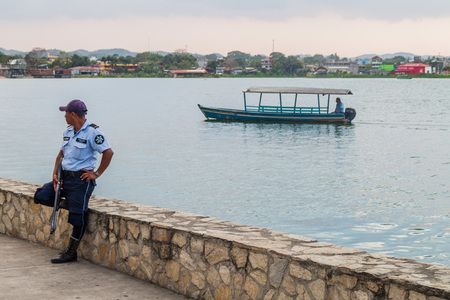 FLORES, GUATEMALA - MARCH 11, 2016: Policeman on a patrol in Flores, Guatemalaのeditorial素材