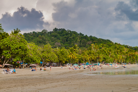 MANUEL ANTONIO, COSTA RICA - MAY 13, 2016: People on a beach in Manuel Antonio village, Costa Ricaのeditorial素材