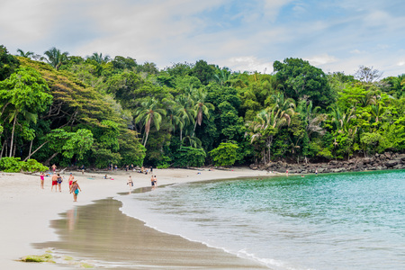MANUEL ANTONIO, COSTA RICA - MAY 13, 2016: Tourists on a beach in National Park Manuel Antonio, Costa Ricaのeditorial素材