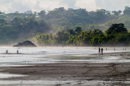 MANUEL ANTONIO, COSTA RICA - MAY 13, 2016: People on a beach in Manuel Antonio village, Costa Ricaのeditorial素材