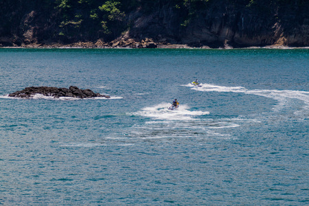 MANUEL ANTONIO, COSTA RICA - MAY 13, 2016: Jet ski riders in National Park Manuel Antonio, Costa Ricaのeditorial素材