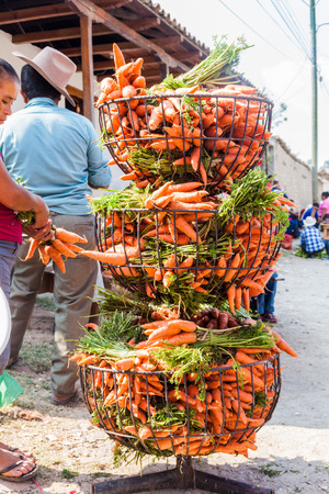 SAN MANUEL DE COLOHETE, HONDURAS - APRIL 15, 2016: Carrots at a market stall. There is a big market in this village twice a month.のeditorial素材