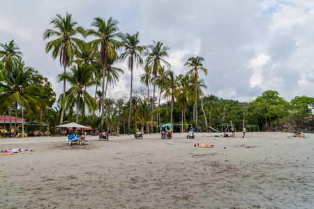 MANUEL ANTONIO, COSTA RICA - MAY 13, 2016: People on a beach in Manuel Antonio village, Costa Ricaのeditorial素材