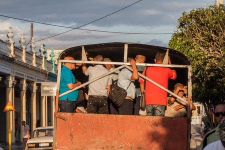 LAS TUNAS, CUBA - JAN 27, 2016: People ride in a truck in Las Tunas. In Cuba, trucks often carry passengers.のeditorial素材