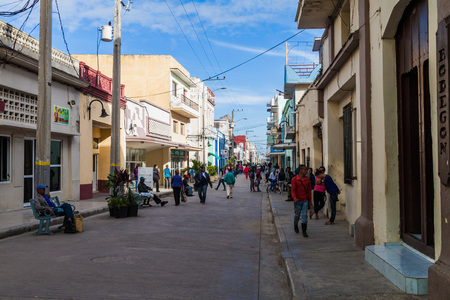 CAMAGUEY, CUBA - JAN 25, 2016: People walk on a street in the center of Camaguey.のeditorial素材