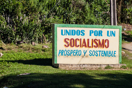 BARACOA, CUBA - FEB 5, 2016: Propaganda billboard in Baracoa. It says: United for the prosperous and sustainable socialism.のeditorial素材
