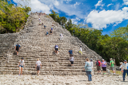 COBA, MEXICO - MARCH 1, 2016: Tourist climb the Pyramid Nohoch Mul at the ruins of the Mayan city Coba, Mexicoのeditorial素材
