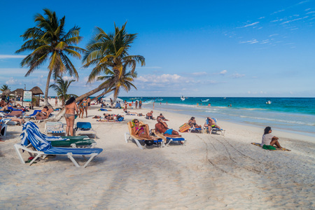 TULUM, MEXIO - FEB 29, 2016: Tourists enjoy the Caribbean beach in Tulum, Mexicoのeditorial素材
