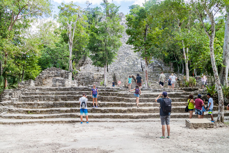COBA, MEXICO - MARCH 1, 2016: Tourist visit the pyramid called The Church (La Iglesia) at the ruins of the Mayan city Coba, Mexicoのeditorial素材