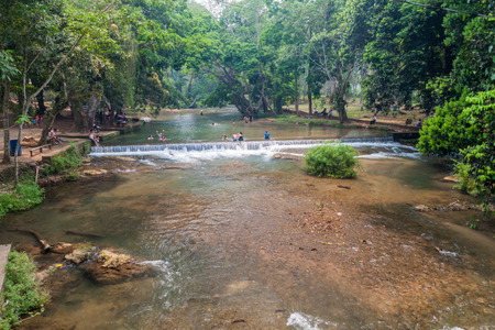 PULHAPANZAK, HONDURAS - APRIL 18, 2016: People are bathing in a river above Pulhapanzak waterfall.のeditorial素材